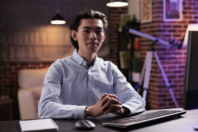 Portrait of businesswoman working at table