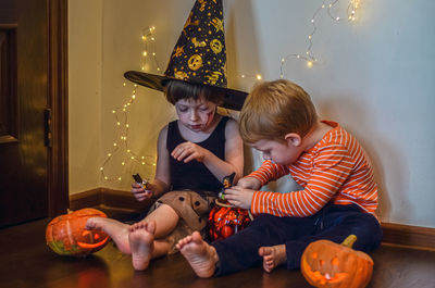 Children eat candies after halloween party.