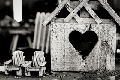 Close-up of heart shape on old chair
