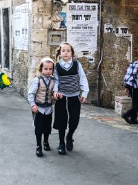 Portrait of a young couple standing outdoors