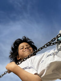 Portrait of smiling girl against sky