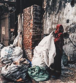 Man in front of built structure