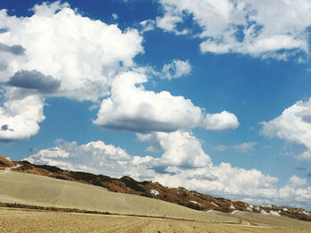 View of landscape against cloudy sky