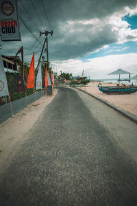 Surface level of road against sky in city