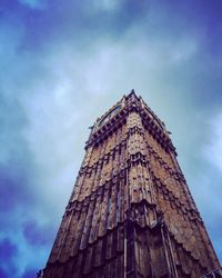 Low angle view of built structure against cloudy sky