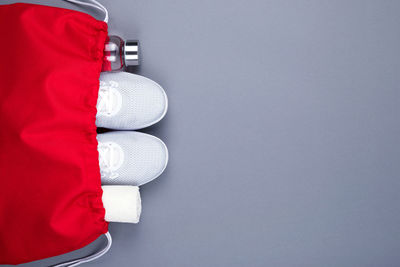 Low section of person standing against white background