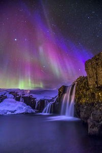 Scenic view of waterfall at night