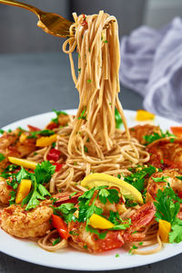 Stir fry noodle with shrimps, asian cuisine, cooked soba