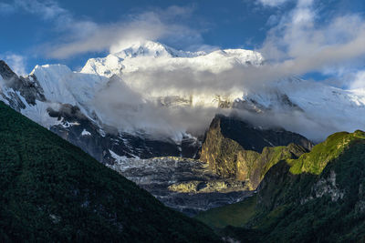 Scenic view of snowcapped mountains against sky