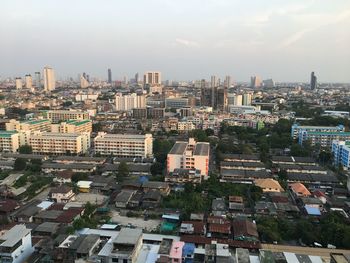 High angle view of buildings in city against sky