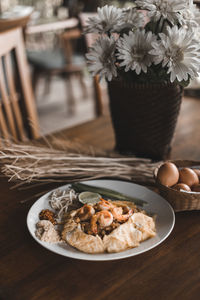 Close-up of breakfast served in plate on table