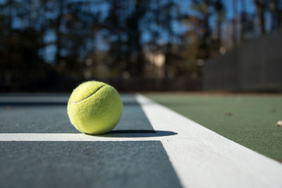 Close-up of tennis ball on court