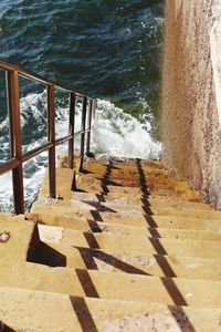 High angle view of walkway by sea