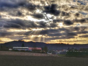 Scenic view of buildings against sky during sunset