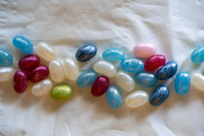 High angle view of multi colored candies on table