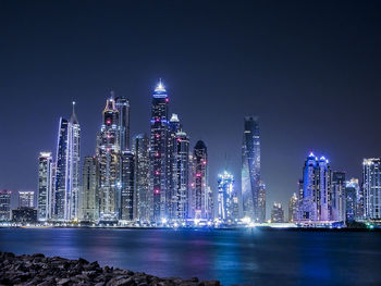 Illuminated cityscape at night