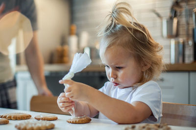 Close-up of girl making cookies