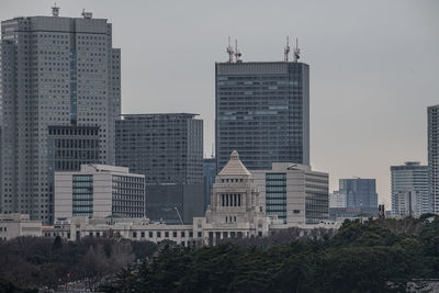 Modern buildings in city against sky