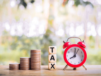 Close-up of alarm clock on table
