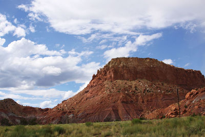 Countryside landscape against rocky mountains