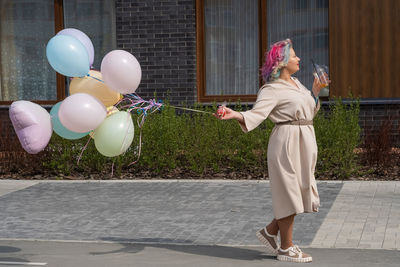 Young woman with balloons