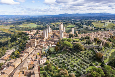 Italy, tuscany, san gimignano, helicopter view of historic town in summer