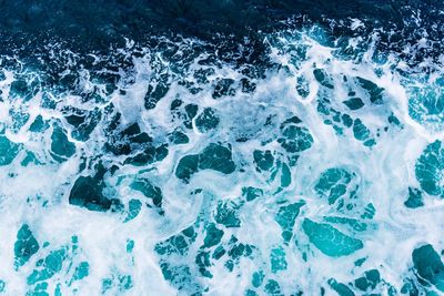 High angle view of water splashing in sea