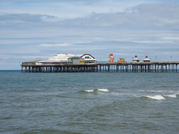 Pier over sea against sky