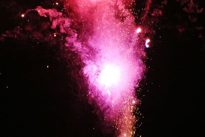 Firework display at night