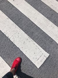 Low section of woman standing on tiled floor