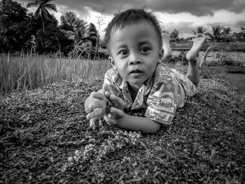 Portrait of cute girl on field