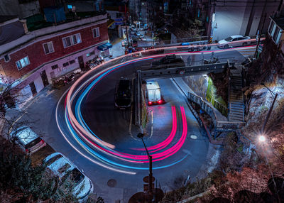 High angle view of light trails on road at night