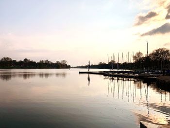 Scenic view of lake against sky during sunset