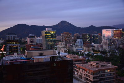 High angle view of buildings in city against sky