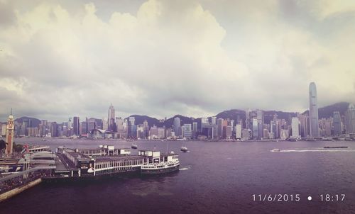 Boats in river with buildings in background