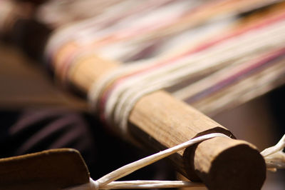 Close-up of threads on wood in handloom