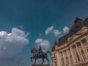 Low angle view of statue against sky