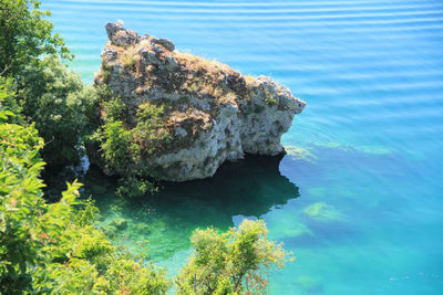 High angle view of rock formation in sea