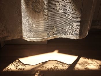 Close-up of curtain hanging at home