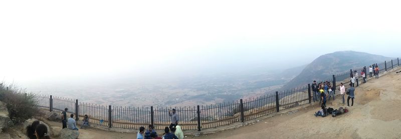 High angle view of people at observation point against clear sky