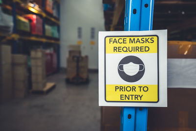 Close-up of warning sign at warehouse