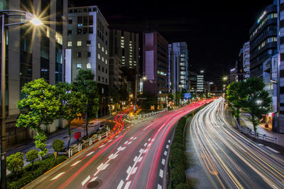 Illuminated city street at night