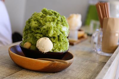 Ice cream in bowl on table at home