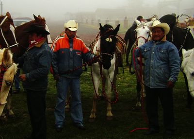 Group of people standing on field