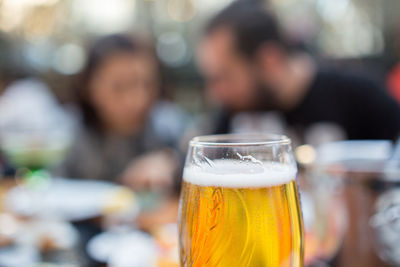 Close-up of beer glass on table