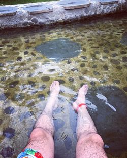 Low section of man legs in water