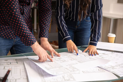 Midsection of business colleagues working at office