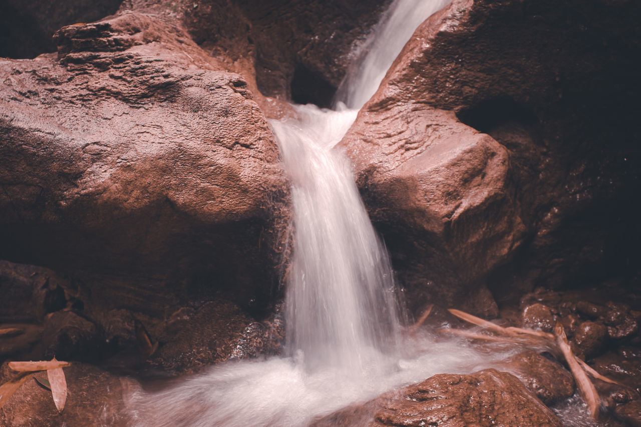 scenics - nature, motion, waterfall, rock, water, beauty in nature, rock formation, rock - object, long exposure, solid, flowing water, blurred motion, no people, power, power in nature, nature, non-urban scene, land, environment, outdoors, flowing, falling water, formation