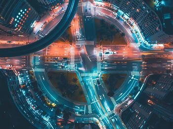 Aerial view of light trails on city street at night