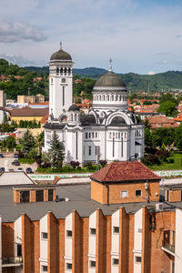 Buildings in city against sky